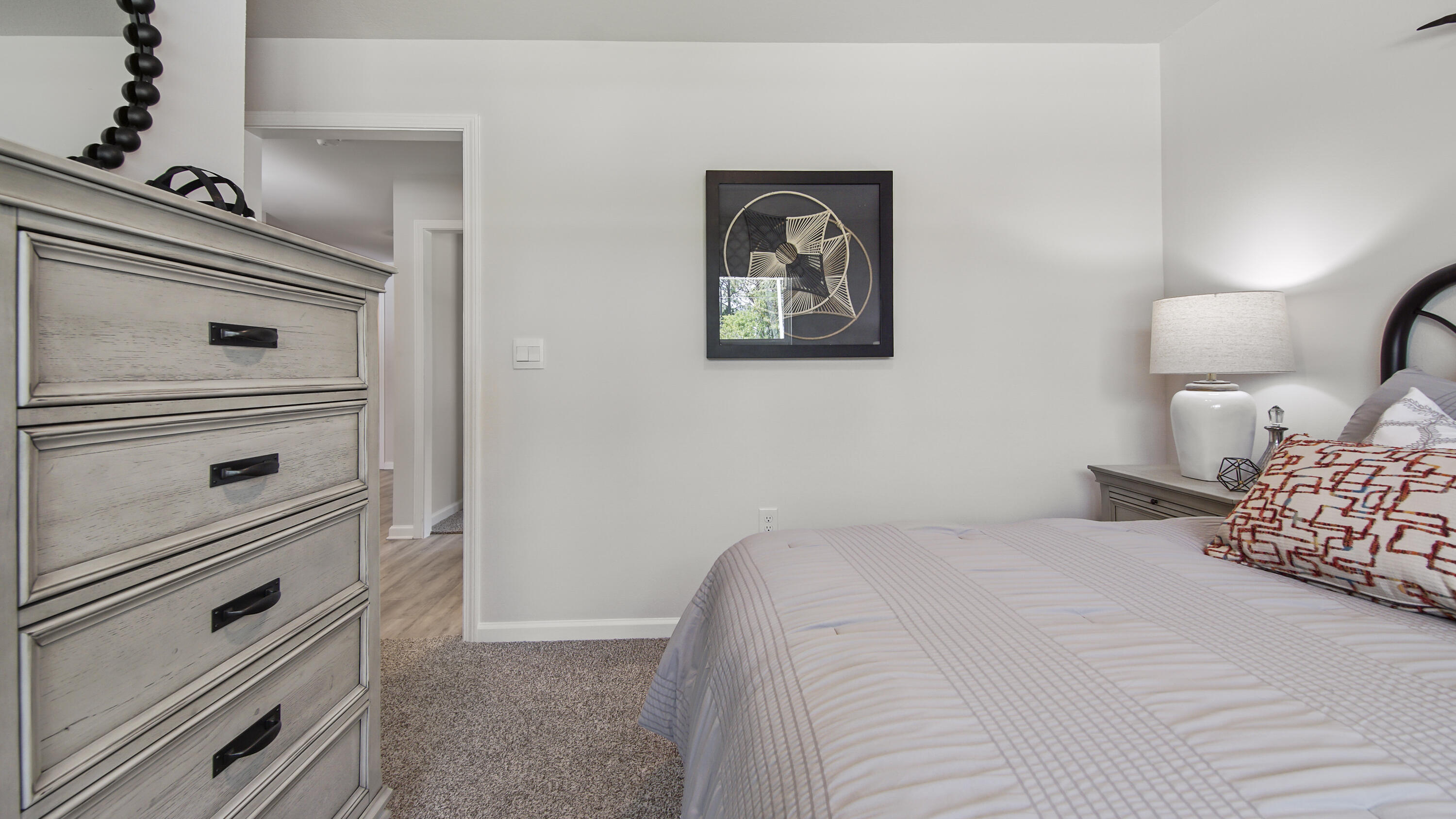 203 Eunola Lane Freeport, FL 32439 - Photo 24 of 38 a bedroom with a bed and a dresser