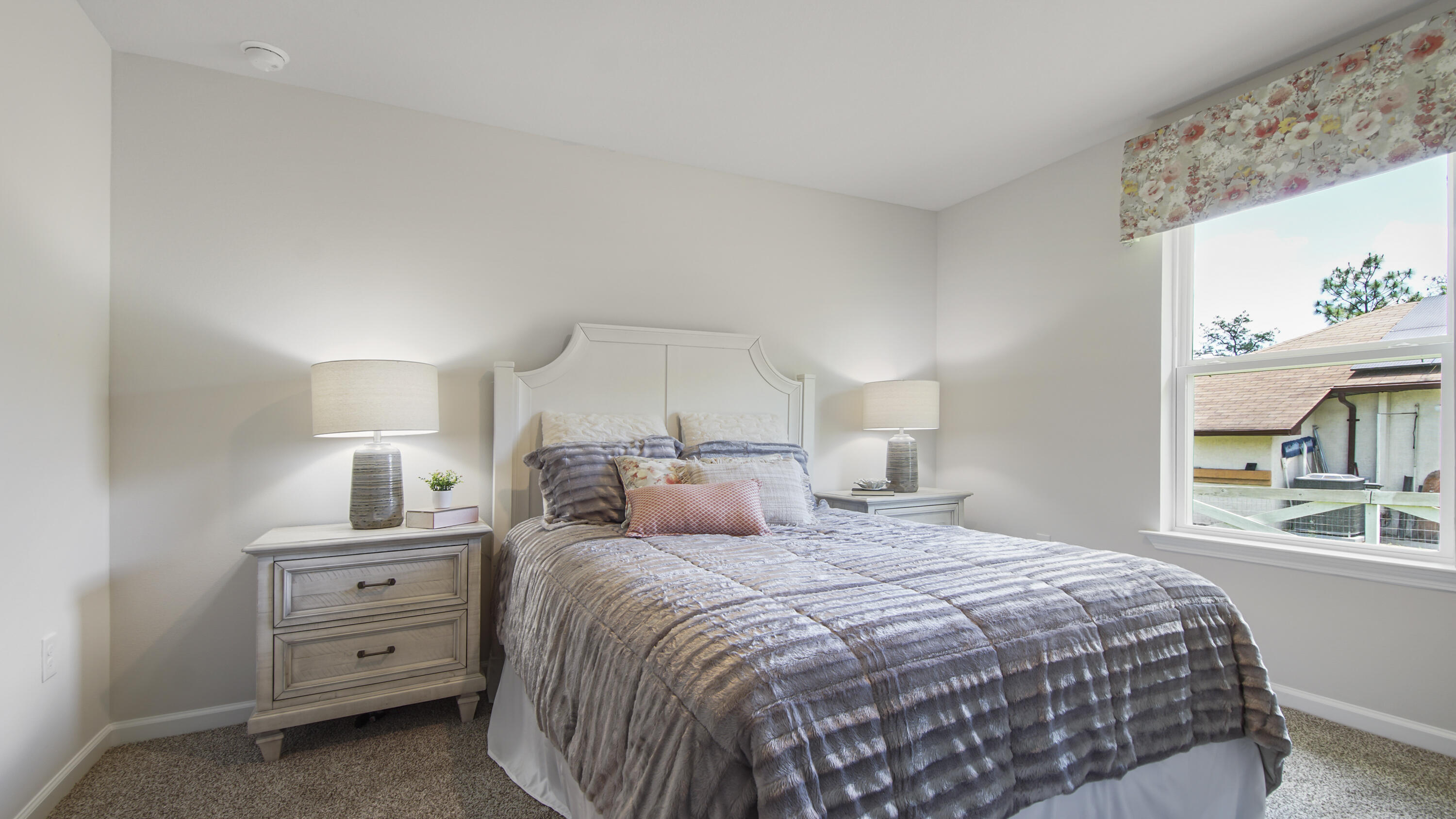 203 Eunola Lane Freeport, FL 32439 - Photo 29 of 38 a bedroom with a large bed and a window