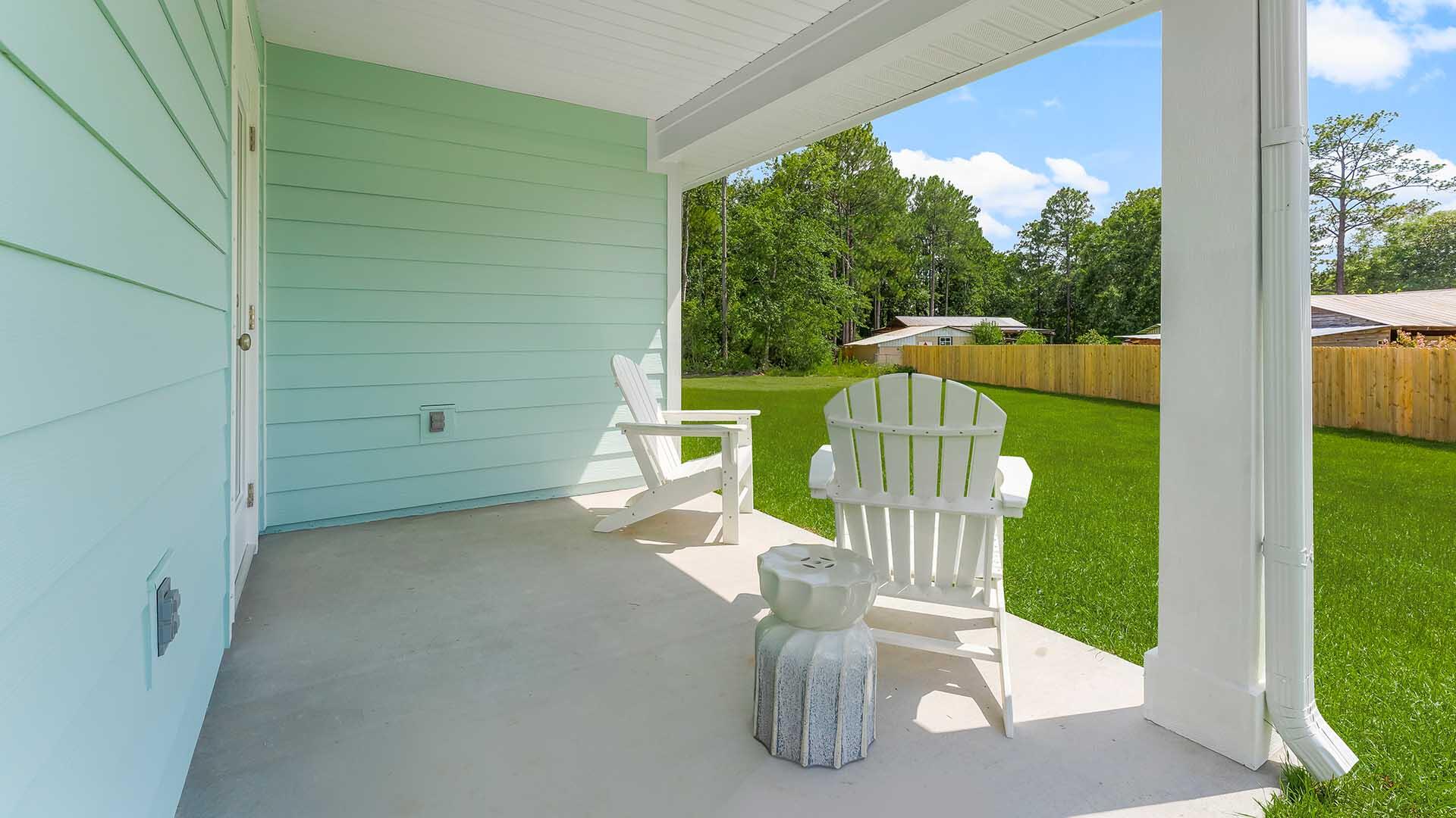 203 Eunola Lane Freeport, FL 32439 - Photo 34 of 38 a view of a chair and table in the balcony