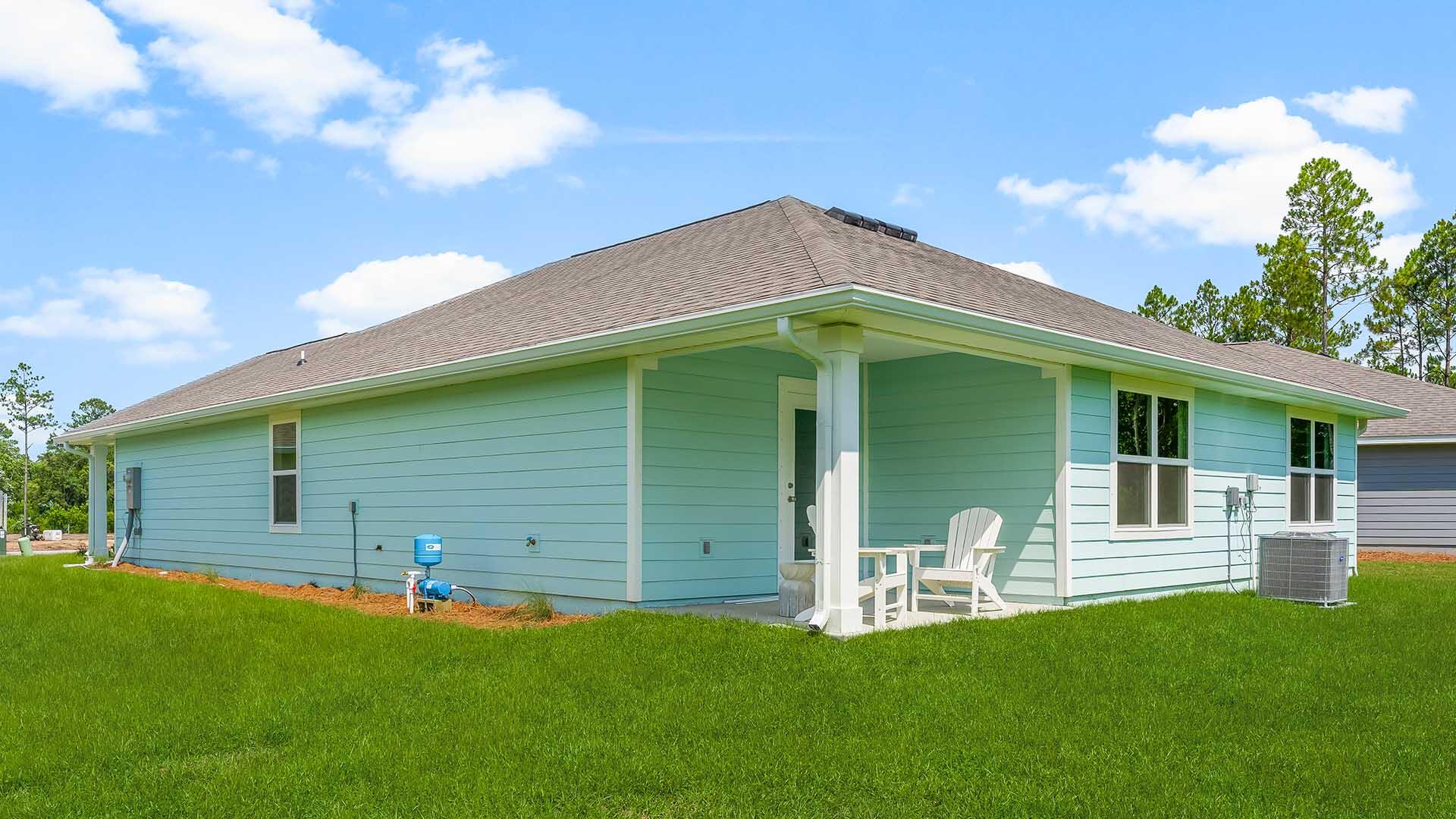 203 Eunola Lane Freeport, FL 32439 - Photo 35 of 38 a backyard of a house with table and chairs