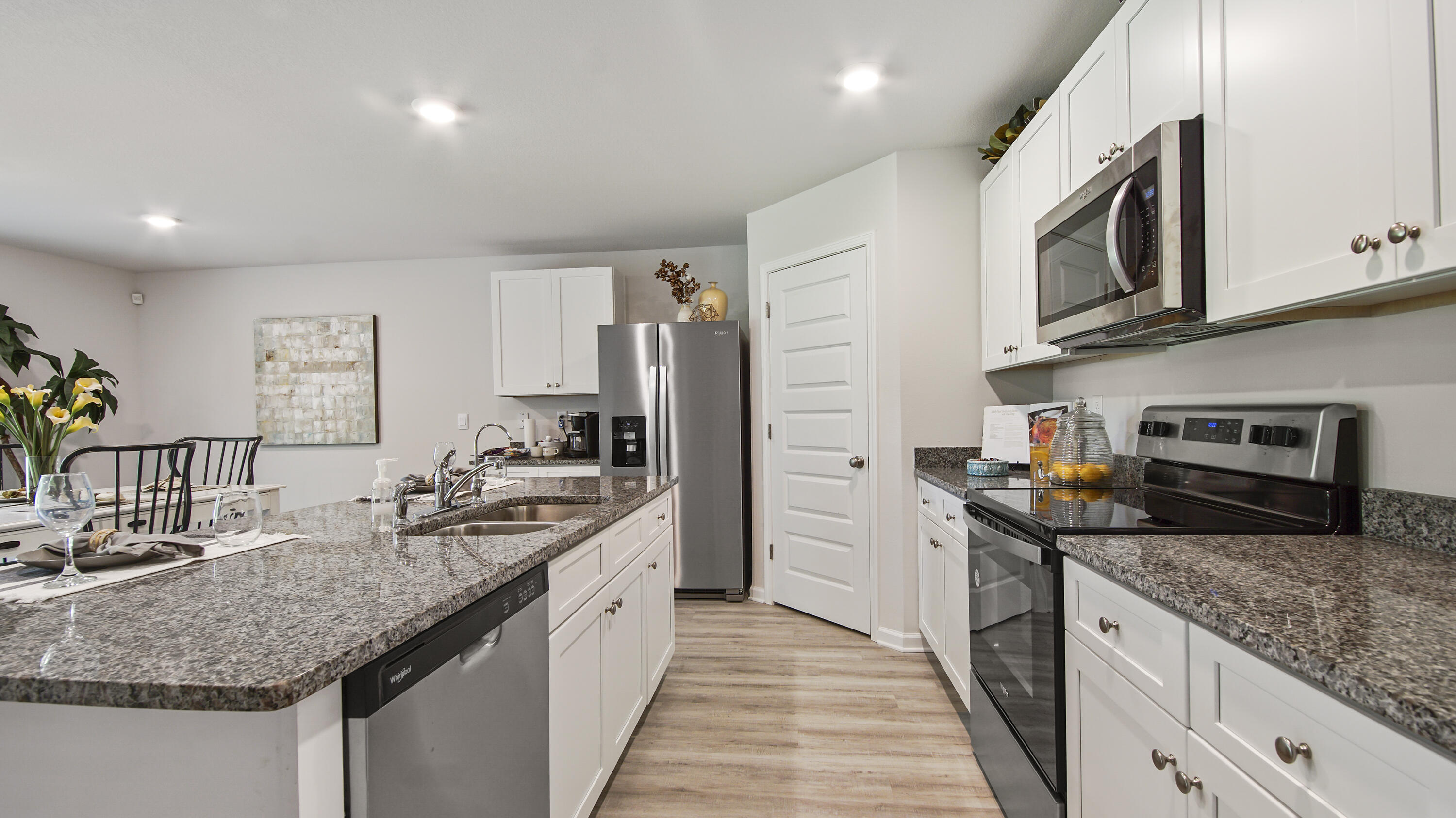 203 Eunola Lane Freeport, FL 32439 - Photo 4 of 38 a kitchen with stainless steel appliances granite countertop a sink stove and refrigerator