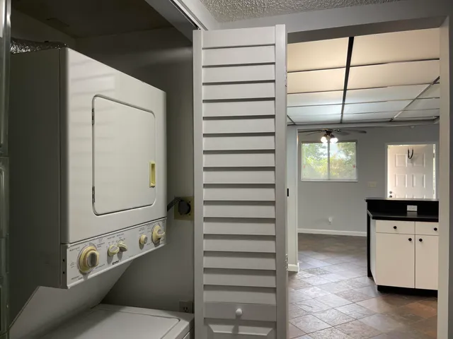 a bathroom with a window and a sink