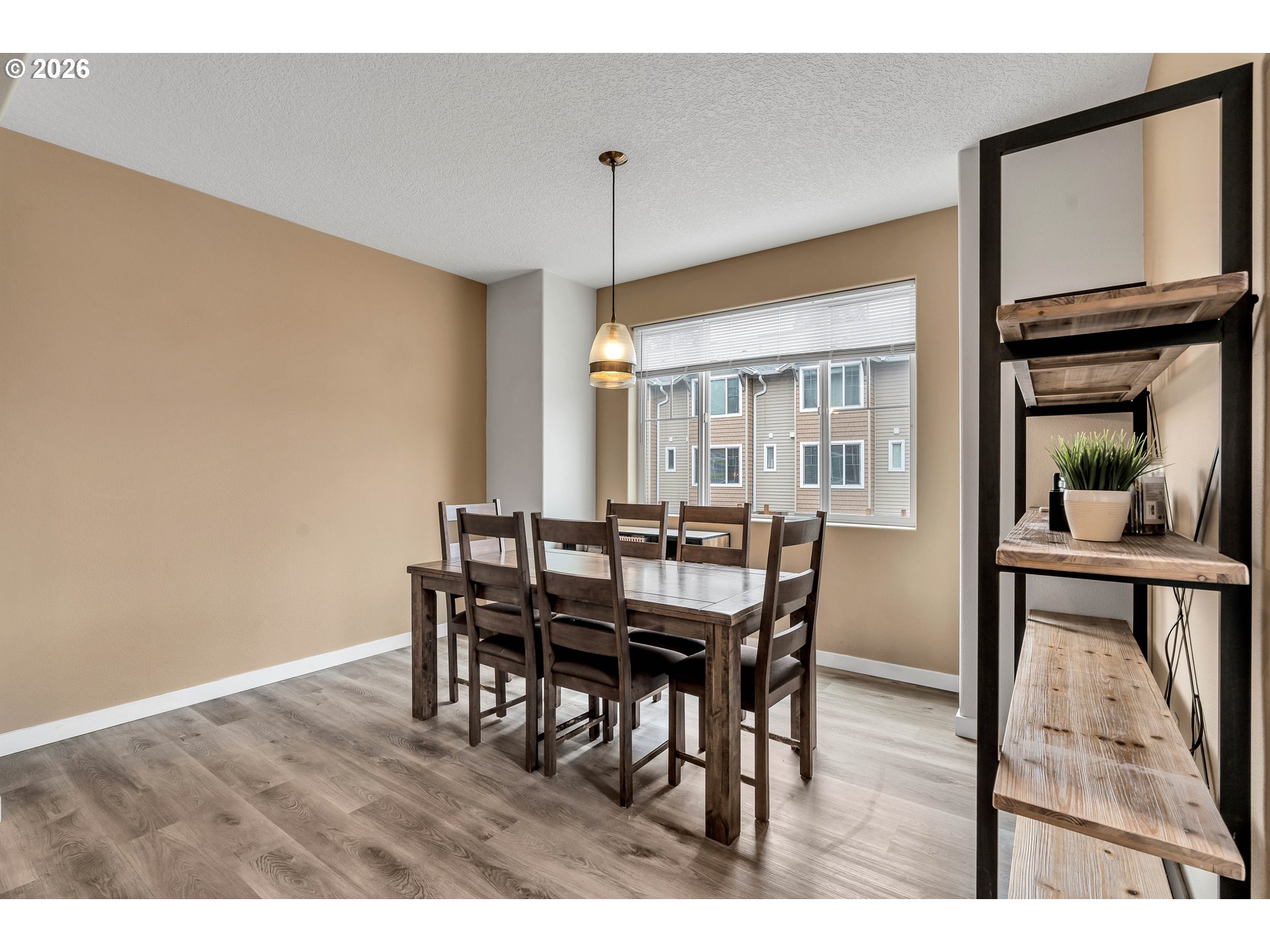 350 Northwest 116th Avenue, Unit 101 Portland, OR 97229 - Photo 14 of 38 a view of a dining room with furniture window and wooden floor