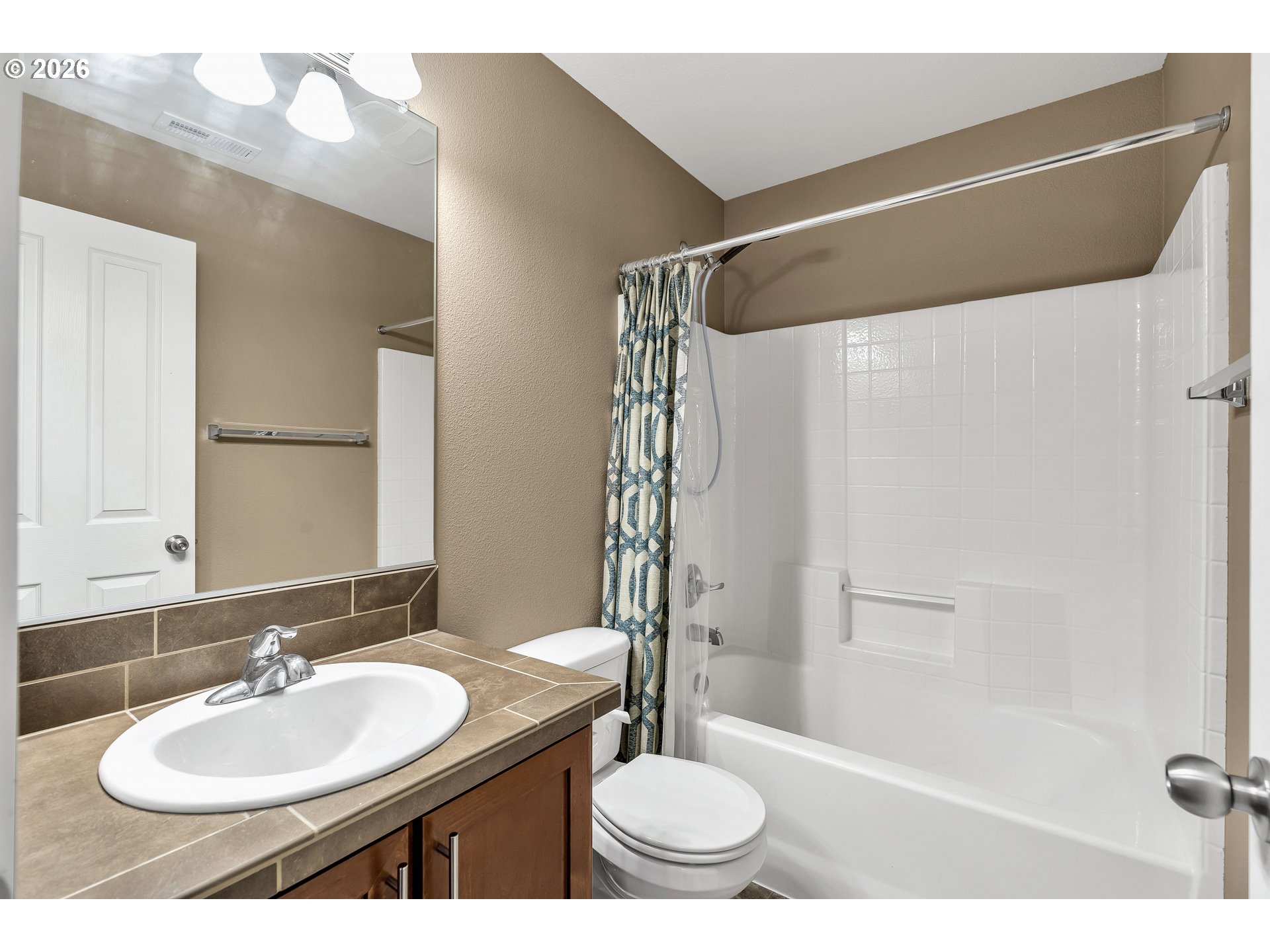 350 Northwest 116th Avenue, Unit 101 Portland, OR 97229 - Photo 19 of 38 a bathroom with a sink toilet and shower