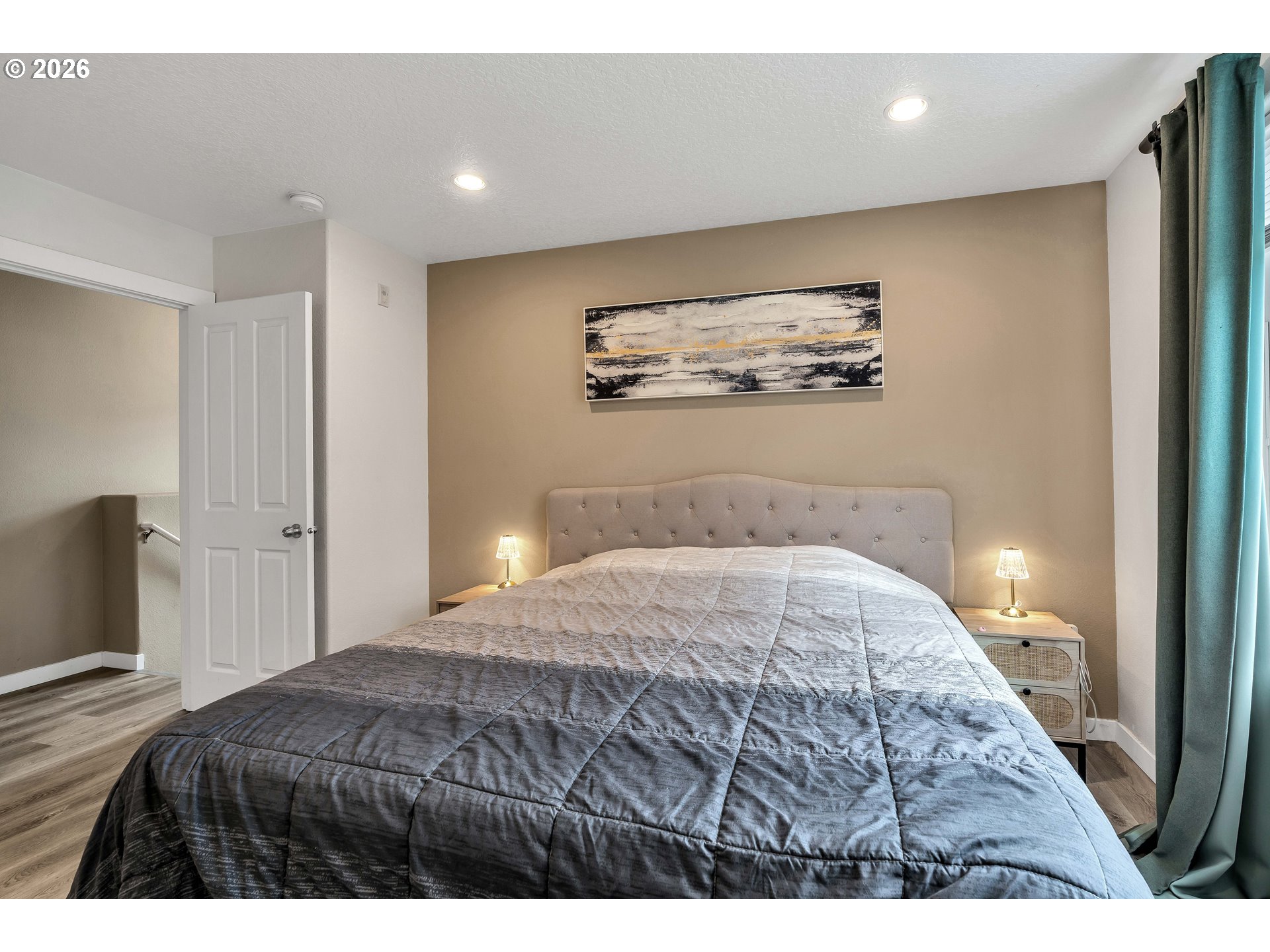 350 Northwest 116th Avenue, Unit 101 Portland, OR 97229 - Photo 24 of 38 a bedroom with a bed and a painting
