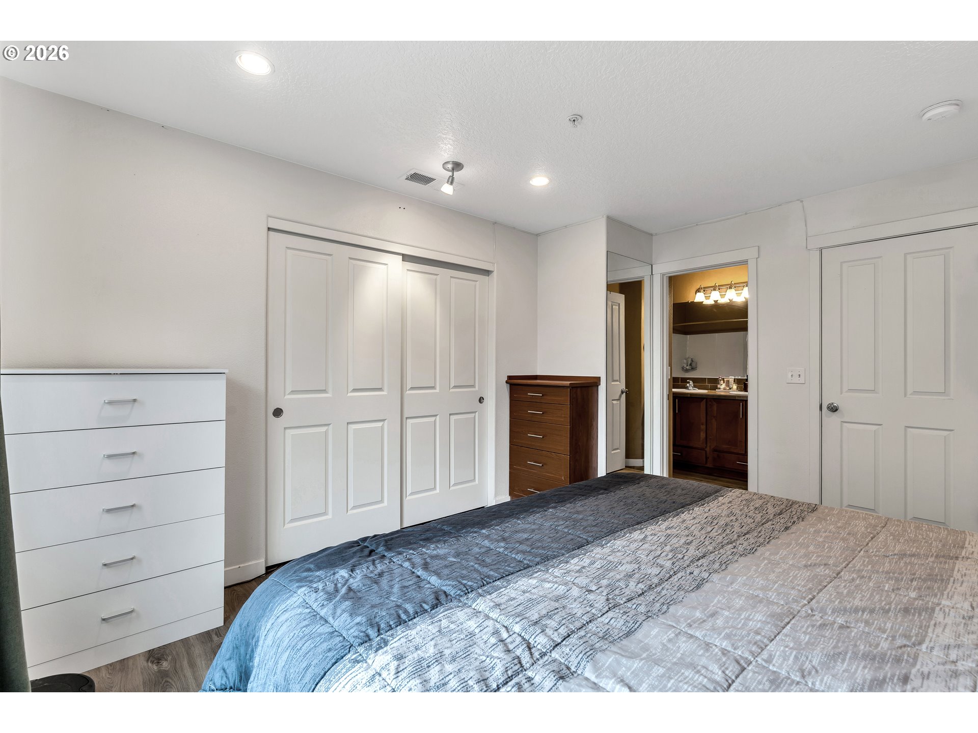 350 Northwest 116th Avenue, Unit 101 Portland, OR 97229 - Photo 25 of 38 a view of a bedroom with closet area