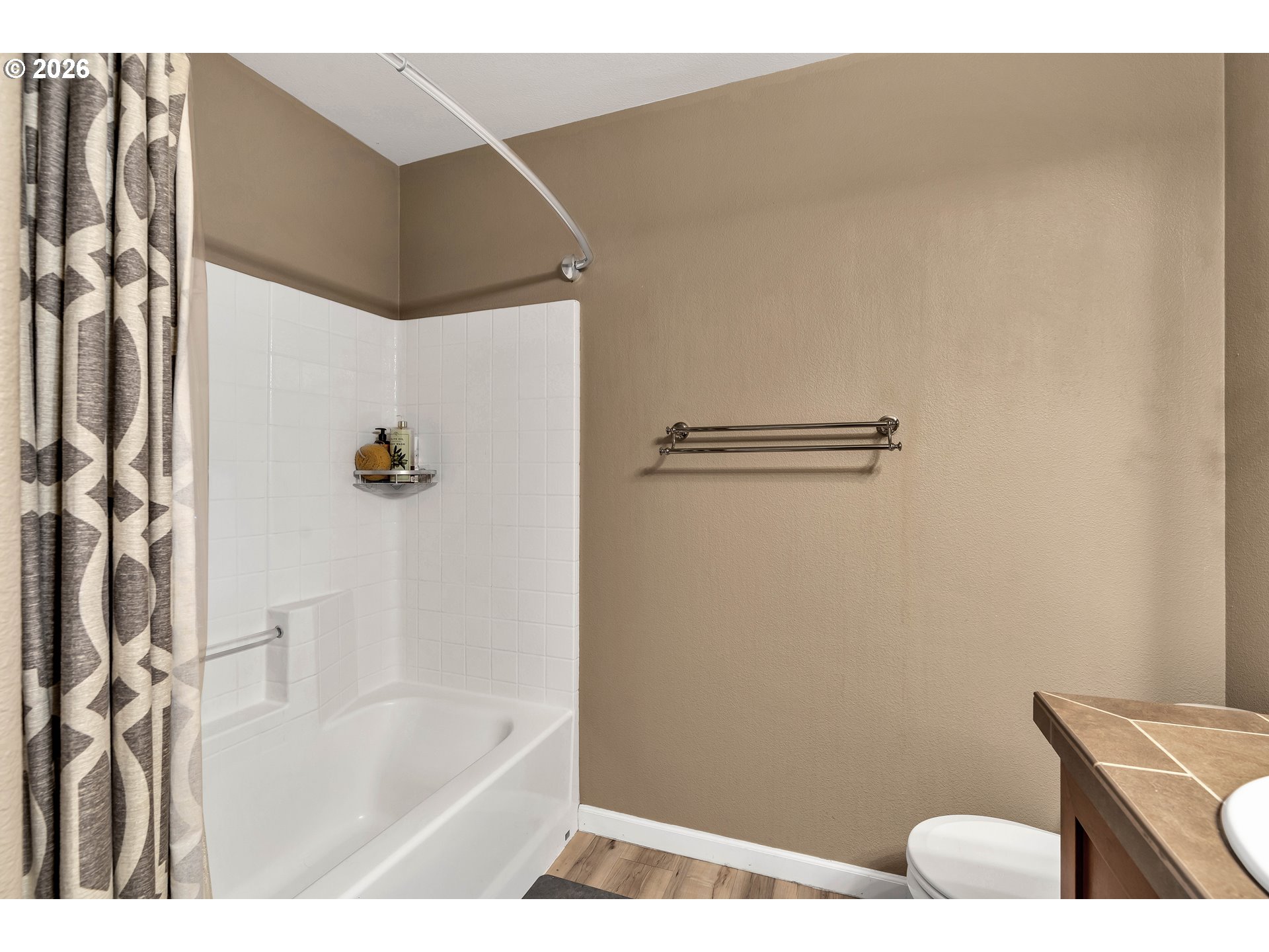 350 Northwest 116th Avenue, Unit 101 Portland, OR 97229 - Photo 27 of 38 a bathroom with a tub and shower