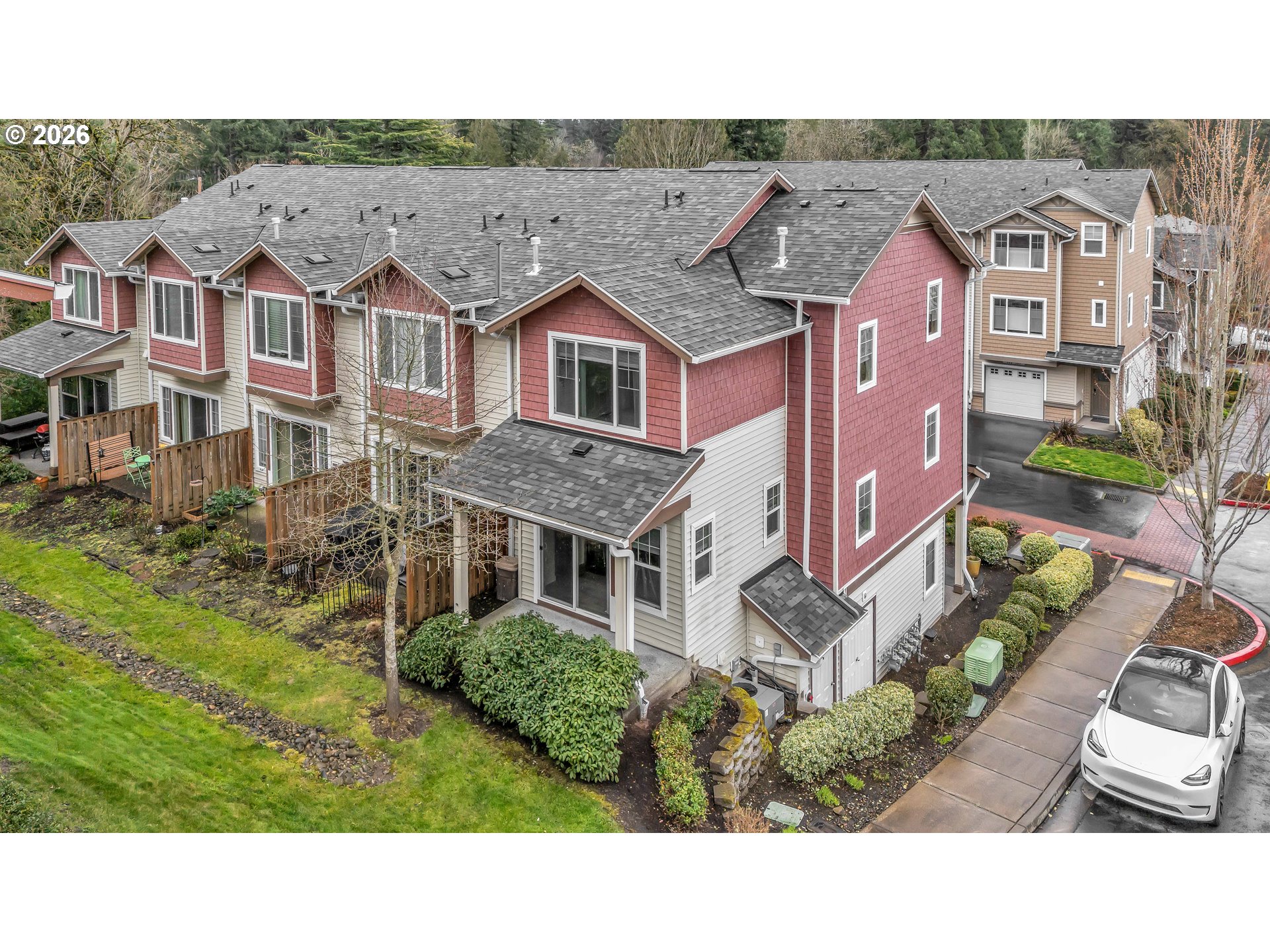 350 Northwest 116th Avenue, Unit 101 Portland, OR 97229 - Photo 30 of 38 a aerial view of a brick house next to a yard