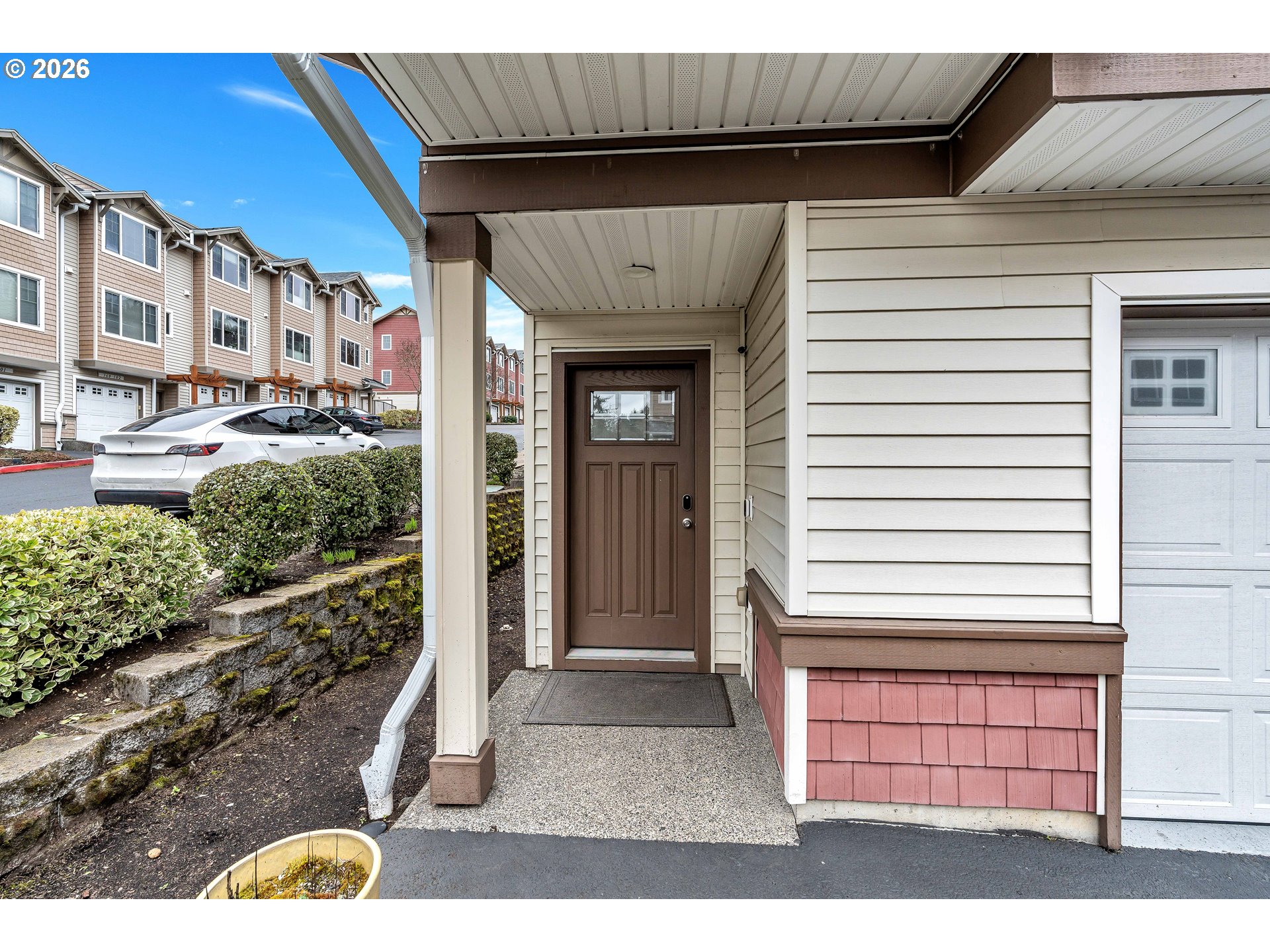350 Northwest 116th Avenue, Unit 101 Portland, OR 97229 - Photo 4 of 38 a view of entrance gate of a house