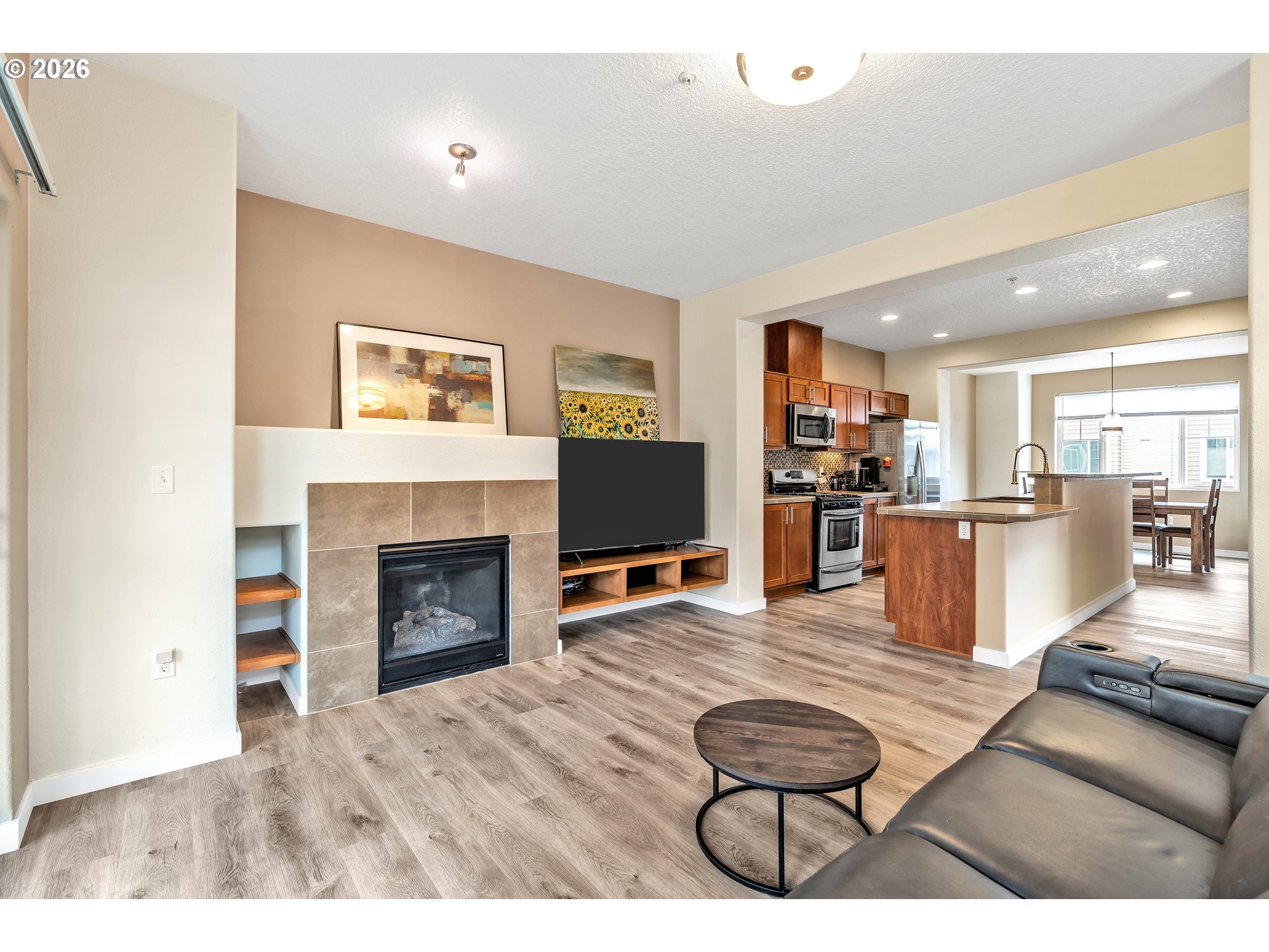350 Northwest 116th Avenue, Unit 101 Portland, OR 97229 - Photo 8 of 38 a living room with furniture and a fireplace
