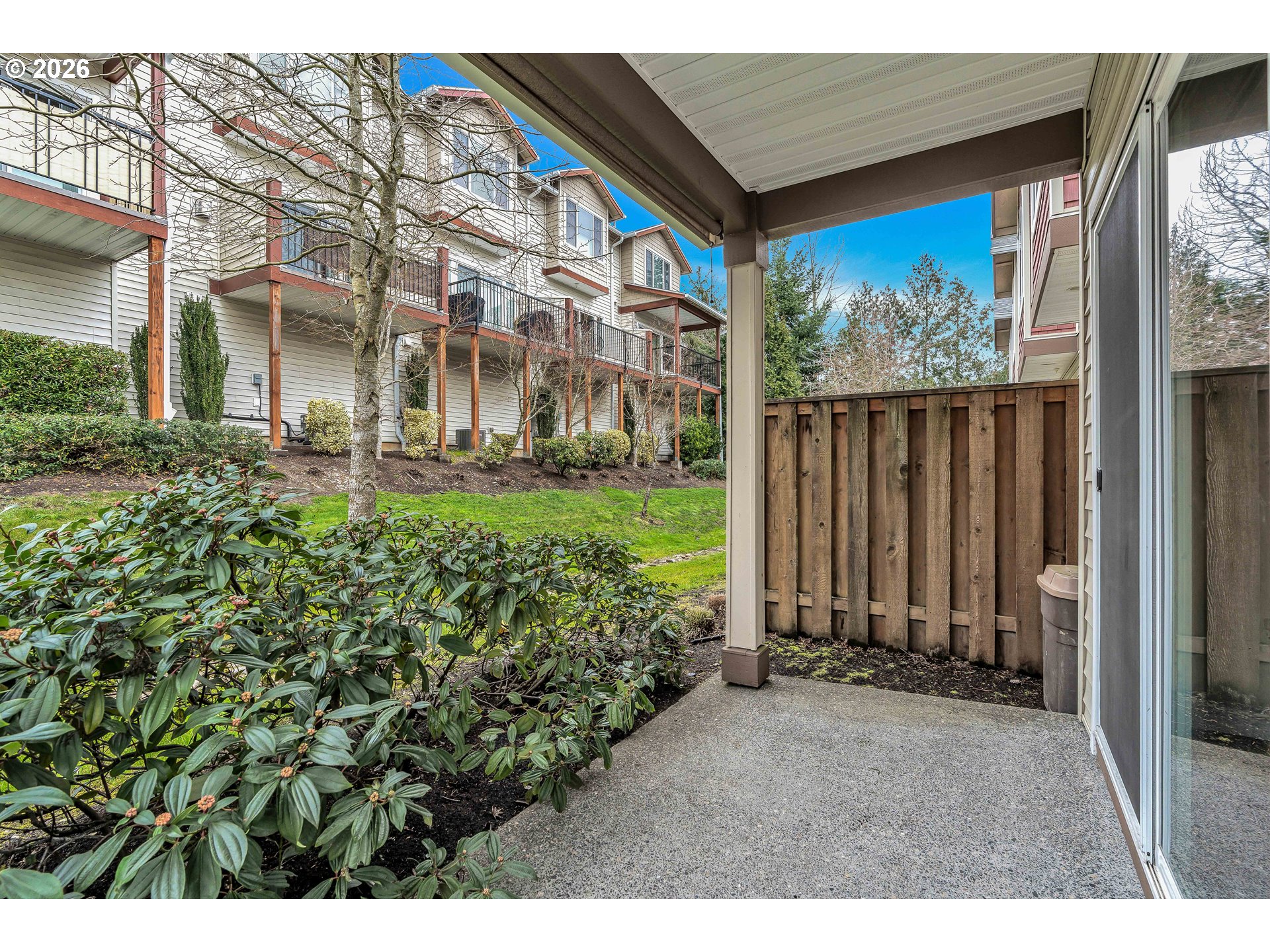 350 Northwest 116th Avenue, Unit 101 Portland, OR 97229 - Photo 9 of 38 a view of a house with a garden