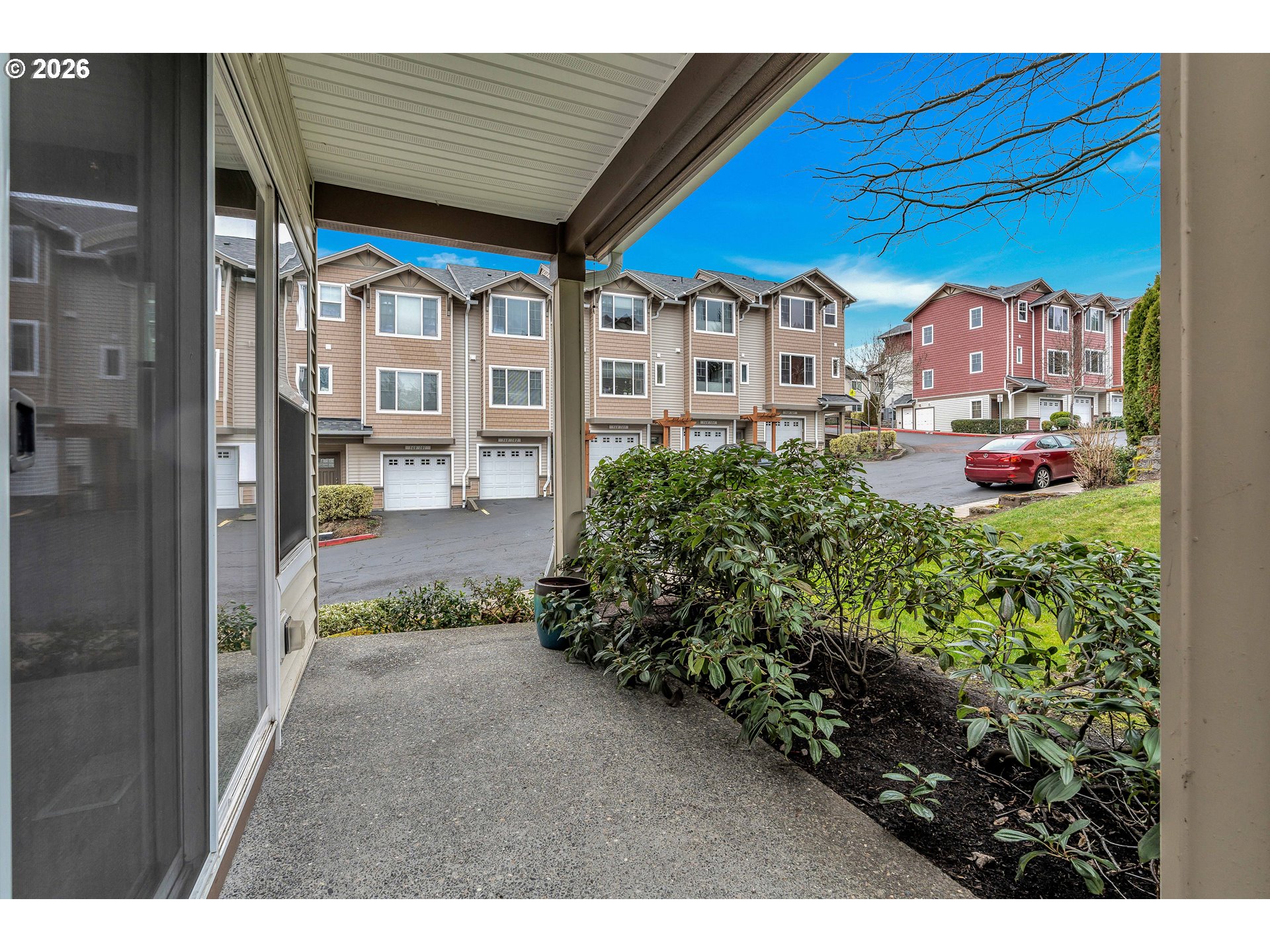 350 Northwest 116th Avenue, Unit 101 Portland, OR 97229 - Photo 10 of 38 a view of a house with a backyard and garden