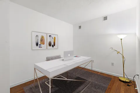 a view of a workspace with furniture