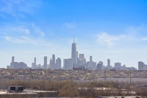 a view of a city with tall buildings in the background