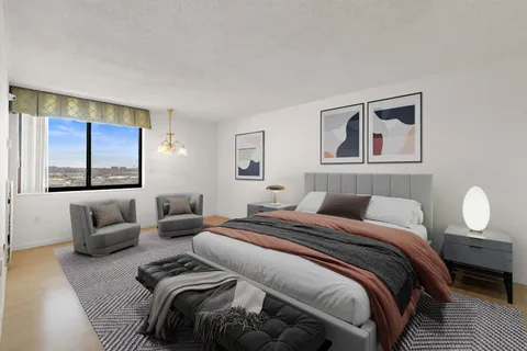 a bedroom with bed and a couch