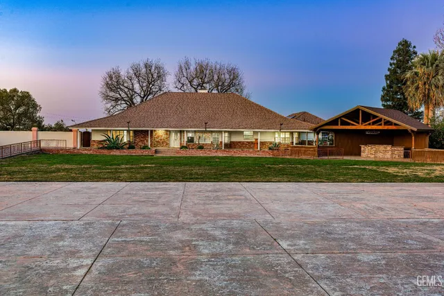 a front view of a house with yard