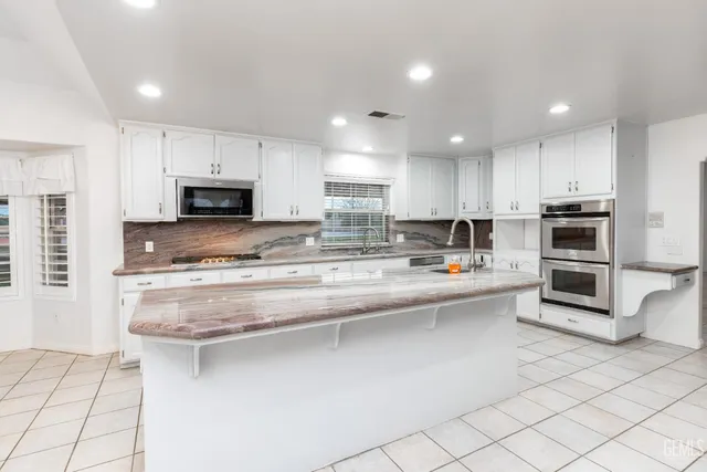 a view of a livingroom with a ceiling fan and window