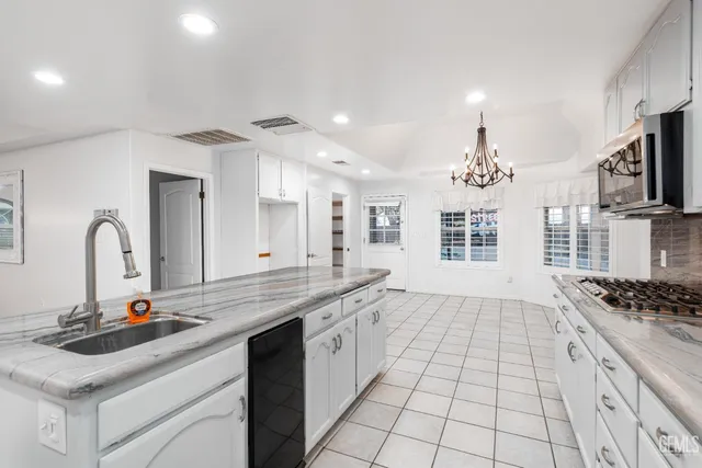 a bathroom with a bathtub sink and mirror