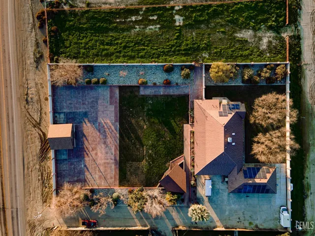 an aerial view of houses with outdoor space