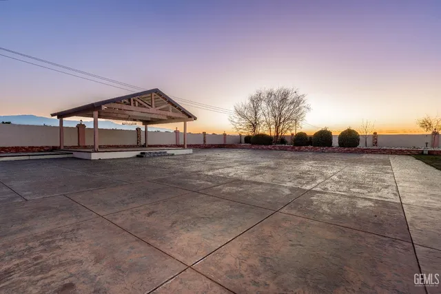 a front view of a house with a yard table and chairs
