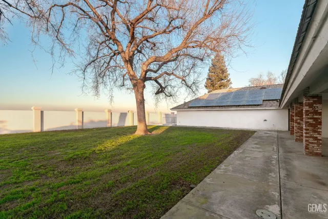 an aerial view of a house with a ocean view