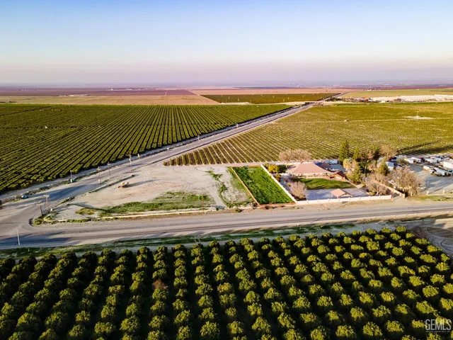 a view of a golf course with chairs