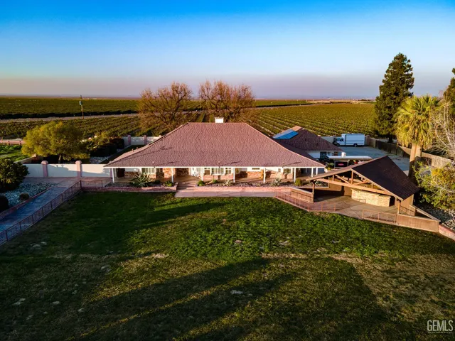 a view of empty room with a fireplace and fan