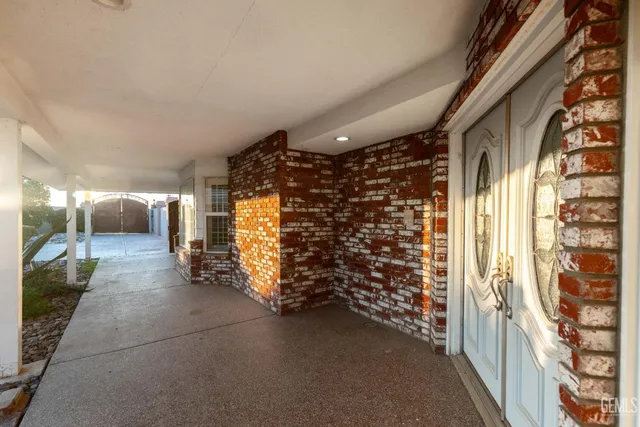 a view of a kitchen with a sink and a chandelier