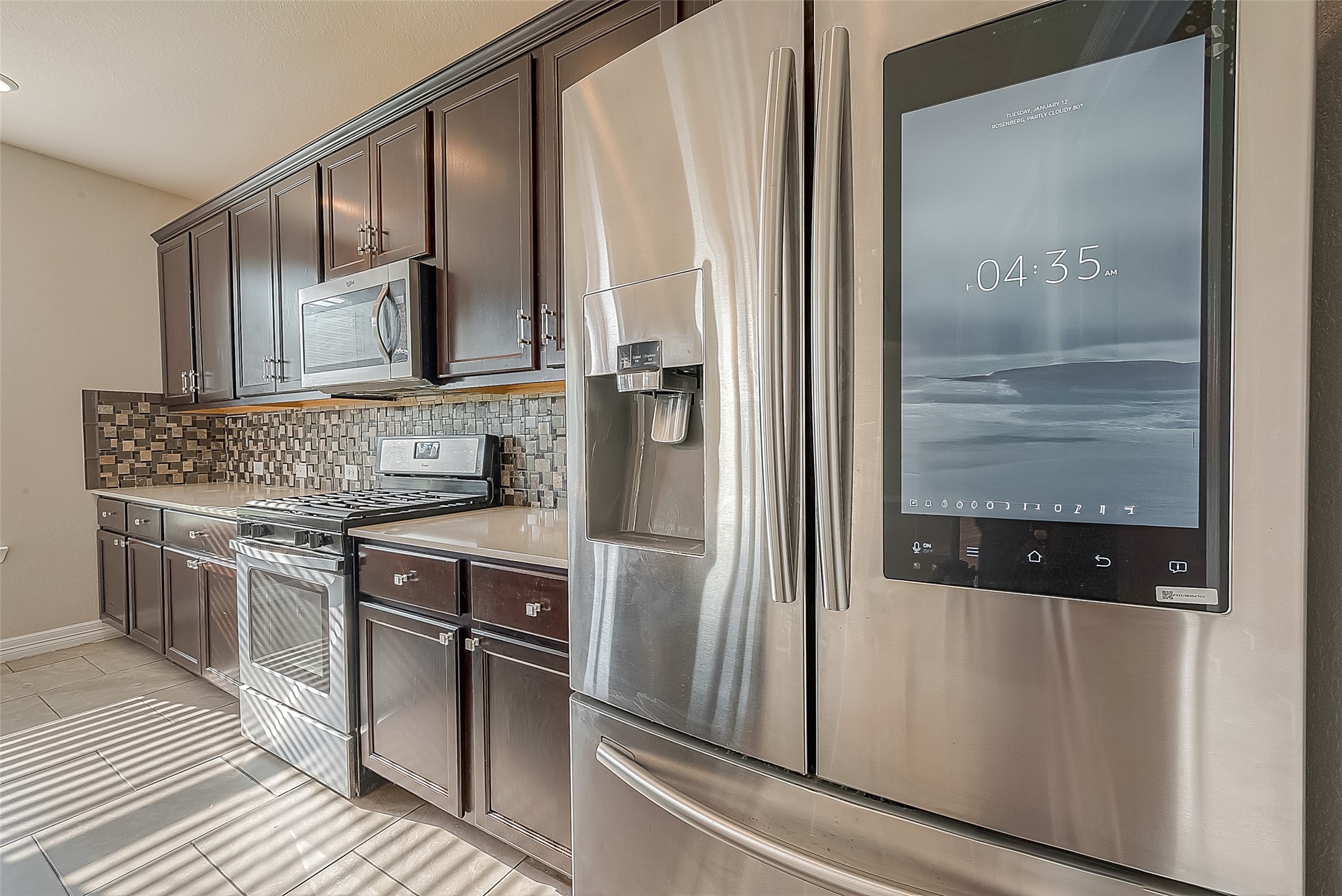 223 Sintra Lk Way Rosenberg, TX 77469 - Photo 12 of 43 a kitchen with stainless steel appliances granite countertop a refrigerator and a sink