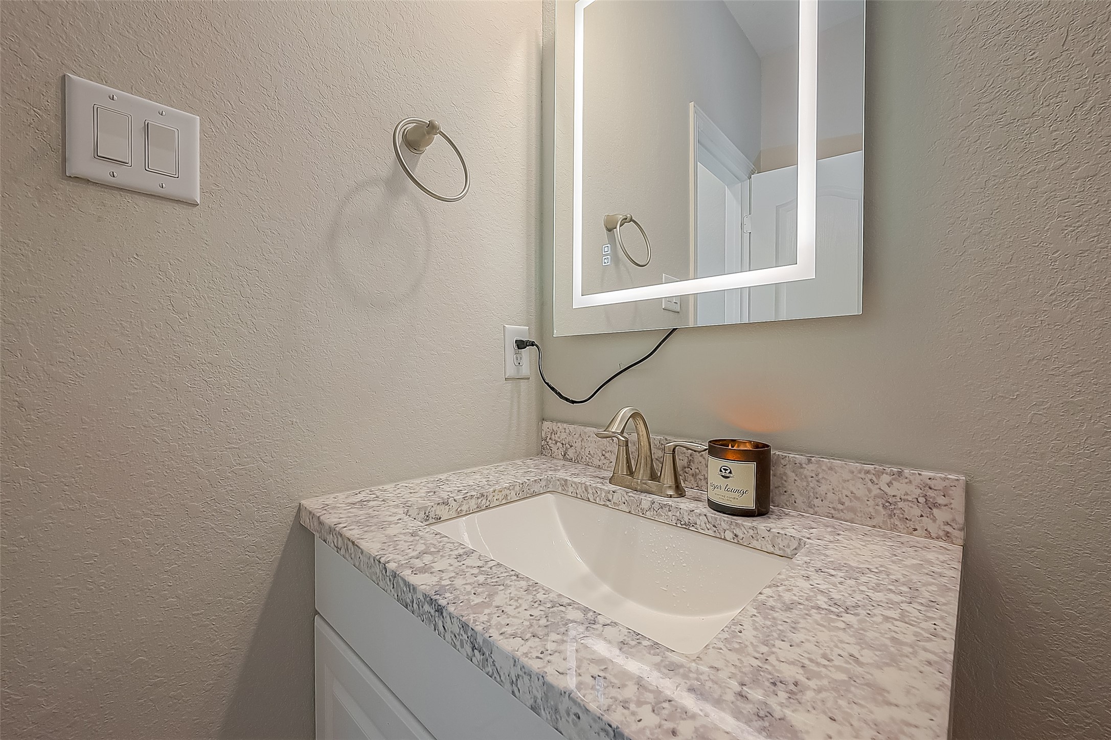 223 Sintra Lk Way Rosenberg, TX 77469 - Photo 14 of 43 a bathroom with a granite countertop sink and a mirror