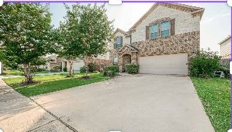 223 Sintra Lk Way Rosenberg, TX 77469 - Photo 2 of 43 a front view of a house with a yard and trees