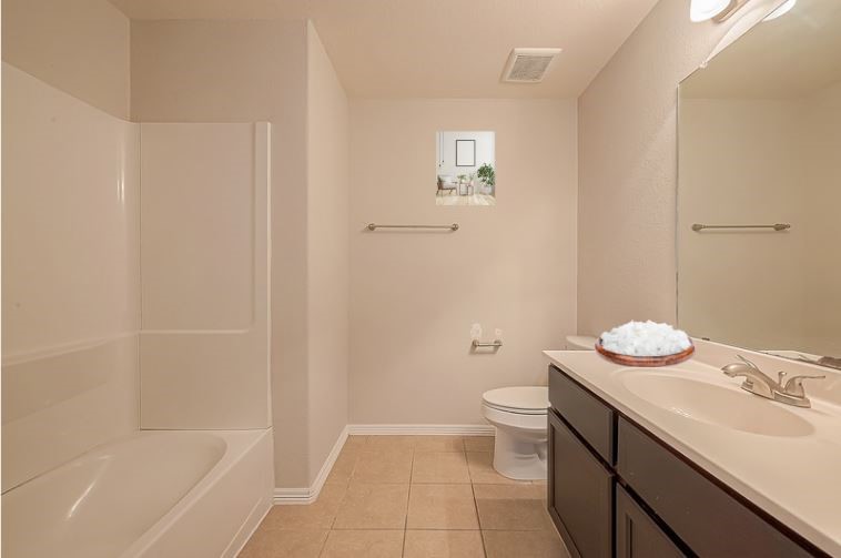 223 Sintra Lk Way Rosenberg, TX 77469 - Photo 25 of 43 a bathroom with a sink a toilet and shower