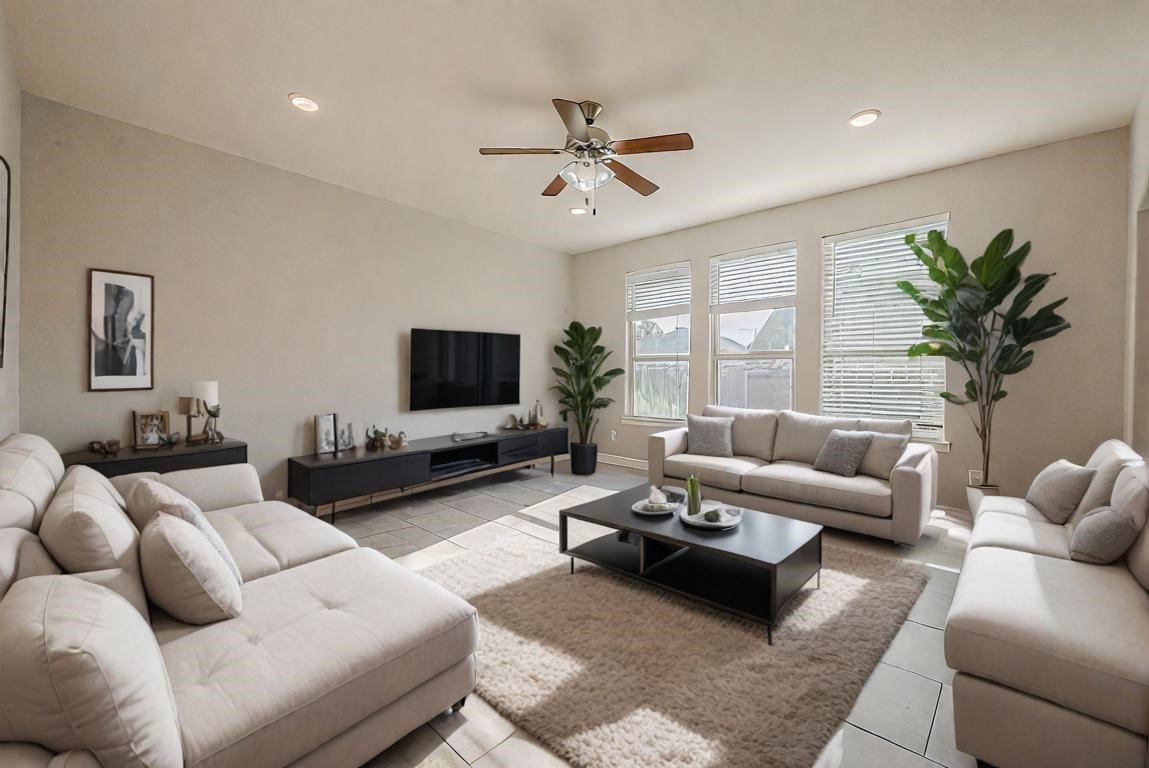 223 Sintra Lk Way Rosenberg, TX 77469 - Photo 10 of 43 a living room with furniture or couch and a flat screen tv