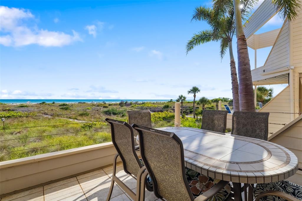 546A Beach Road, Unit A544 Sarasota, FL 34242 - Photo 14 of 59 a view of a chairs and table in patio