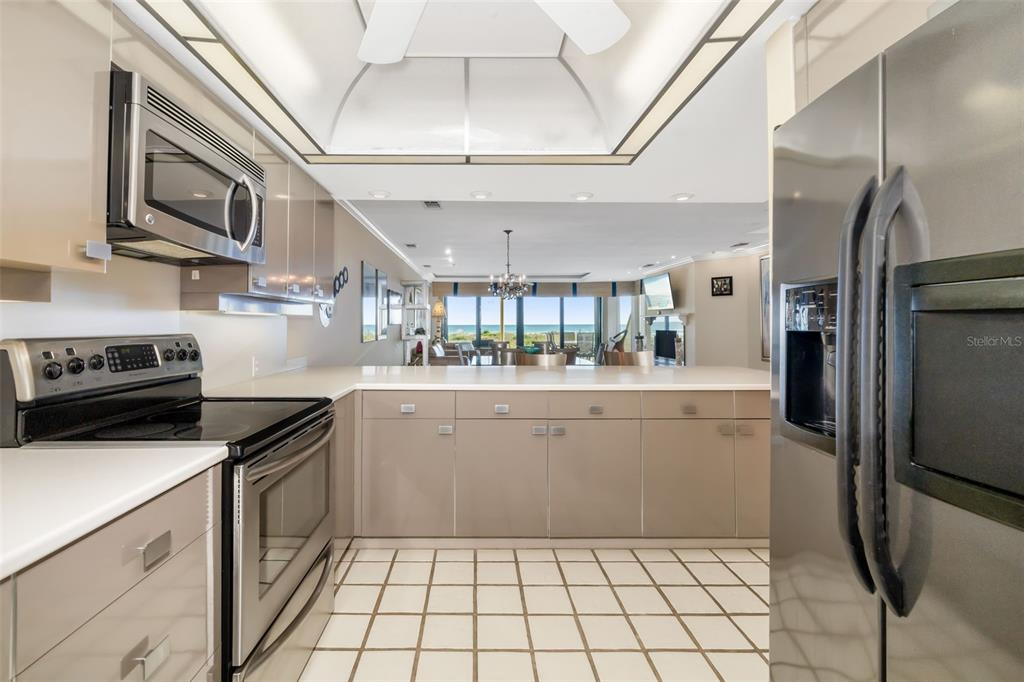 546A Beach Road, Unit A544 Sarasota, FL 34242 - Photo 19 of 59 a kitchen with a sink stainless steel appliances and cabinets