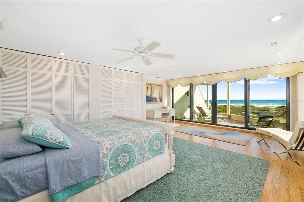 546A Beach Road, Unit A544 Sarasota, FL 34242 - Photo 21 of 59 a bedroom with a large bed and a large window