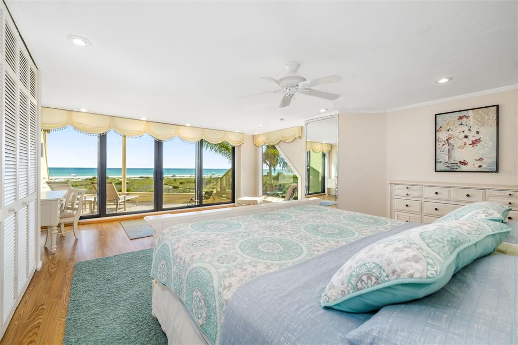 546A Beach Road, Unit A544 Sarasota, FL 34242 - Photo 22 of 59 a bedroom with a large bed and a large window