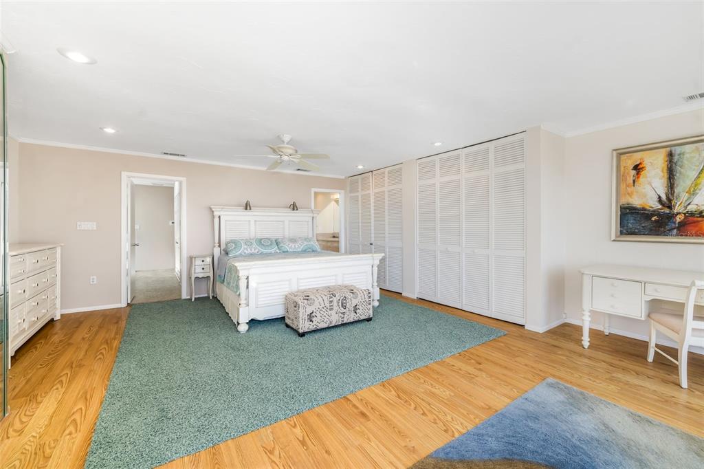 546A Beach Road, Unit A544 Sarasota, FL 34242 - Photo 25 of 59 a bedroom with a bed and a table in it