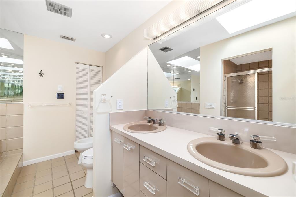 546A Beach Road, Unit A544 Sarasota, FL 34242 - Photo 26 of 59 a bathroom with a sink and a mirror