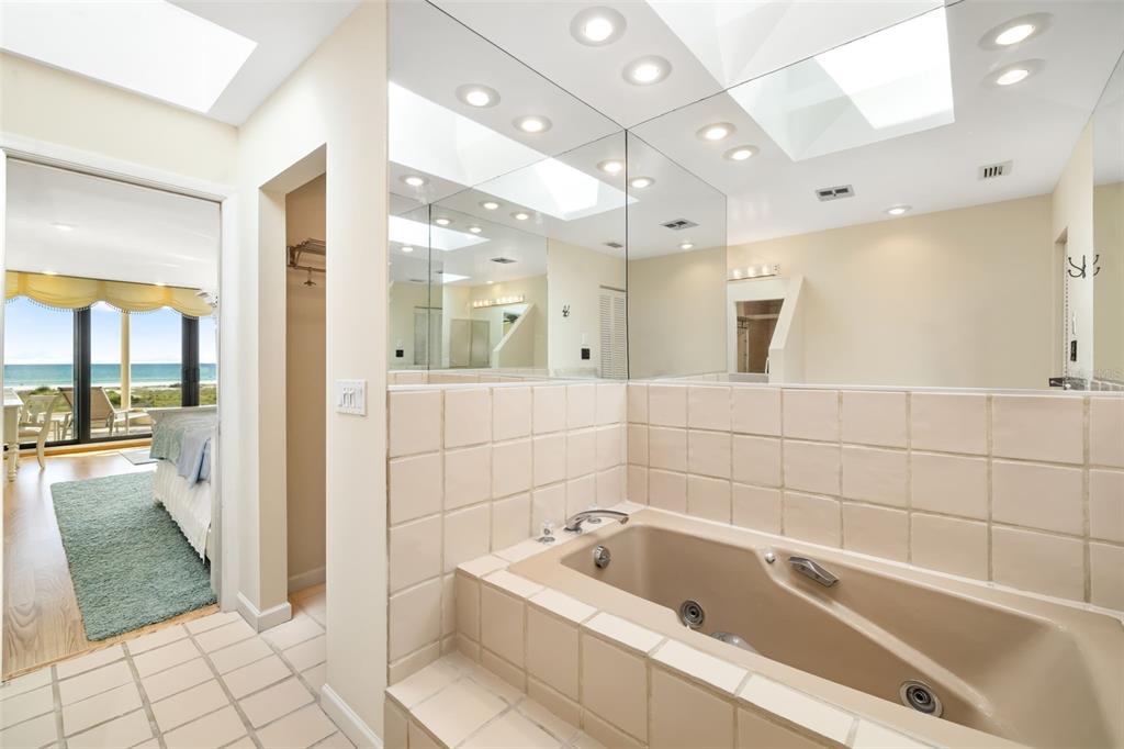 546A Beach Road, Unit A544 Sarasota, FL 34242 - Photo 27 of 59 a bathroom with a tub a sink and a shower