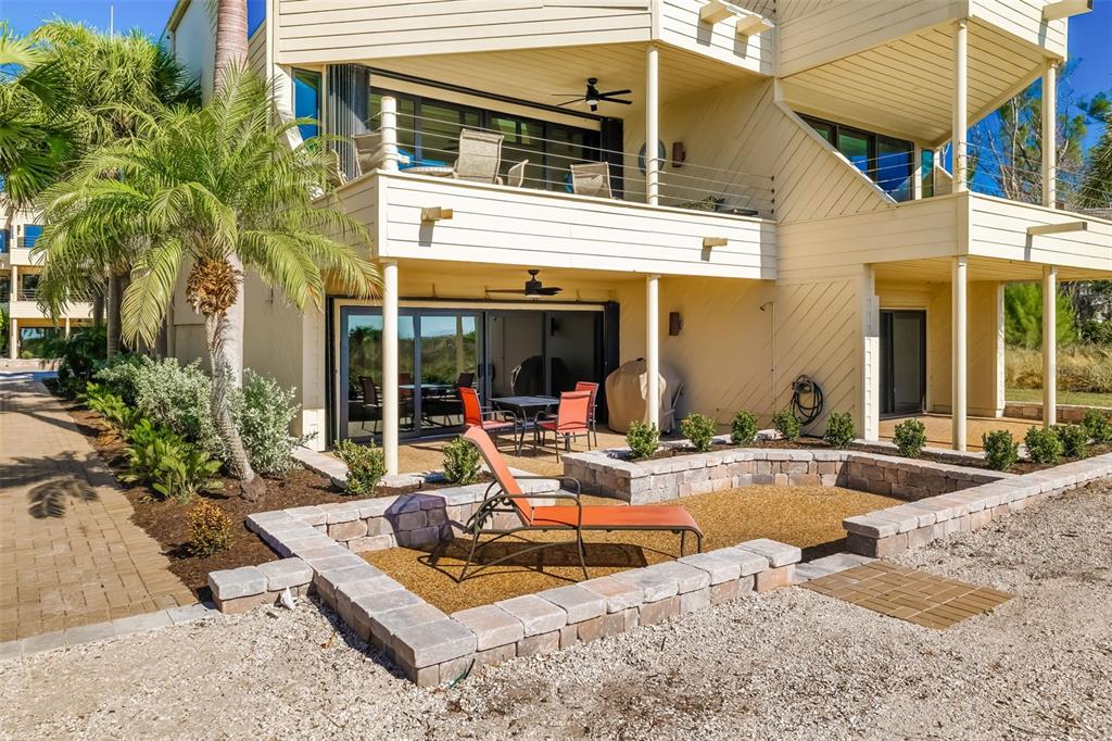 546A Beach Road, Unit A544 Sarasota, FL 34242 - Photo 40 of 59 a view of a house with backyard and sitting area