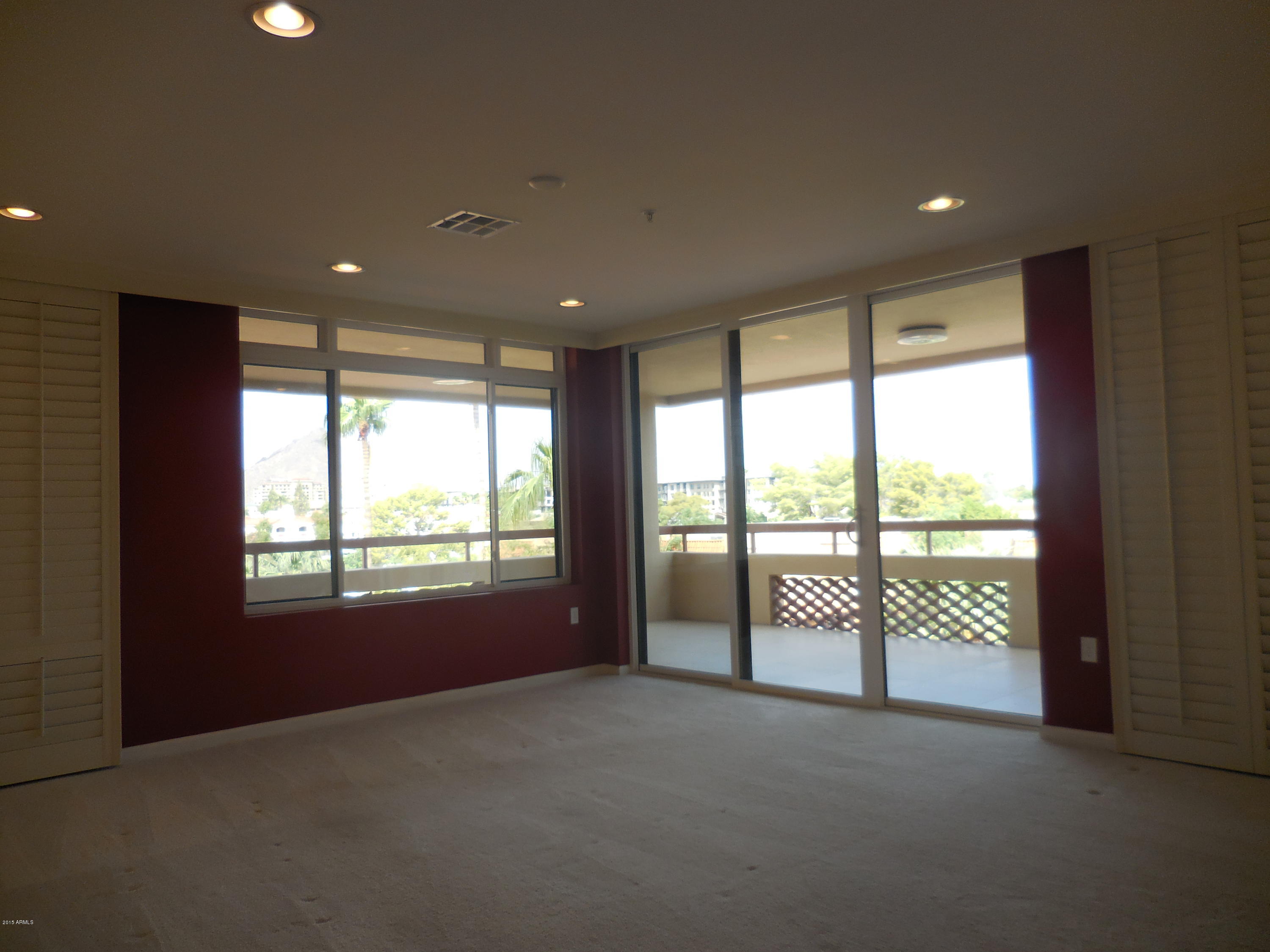 4200 North Miller Road, Unit 427 Scottsdale, AZ 85251 - Photo 8 of 51 Living w/sliding custom shutters