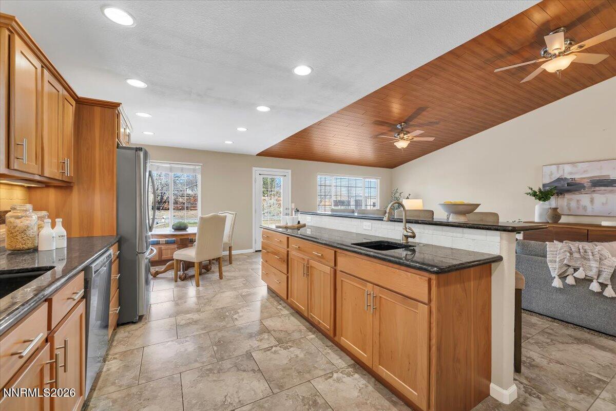 65 Rook Court Sparks, NV 89441 - Photo 19 of 41 a kitchen with granite countertop a sink and cabinets