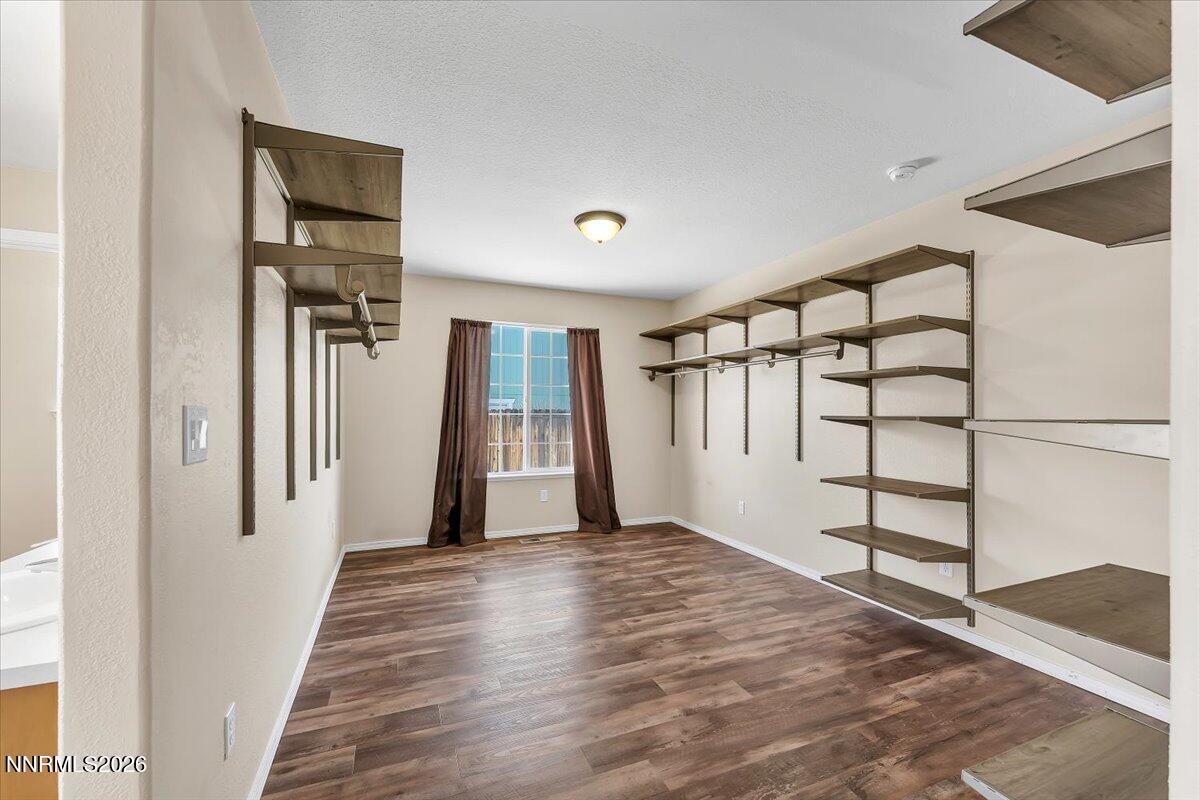 65 Rook Court Sparks, NV 89441 - Photo 22 of 41 a view of a hallway with wooden floor and entryway