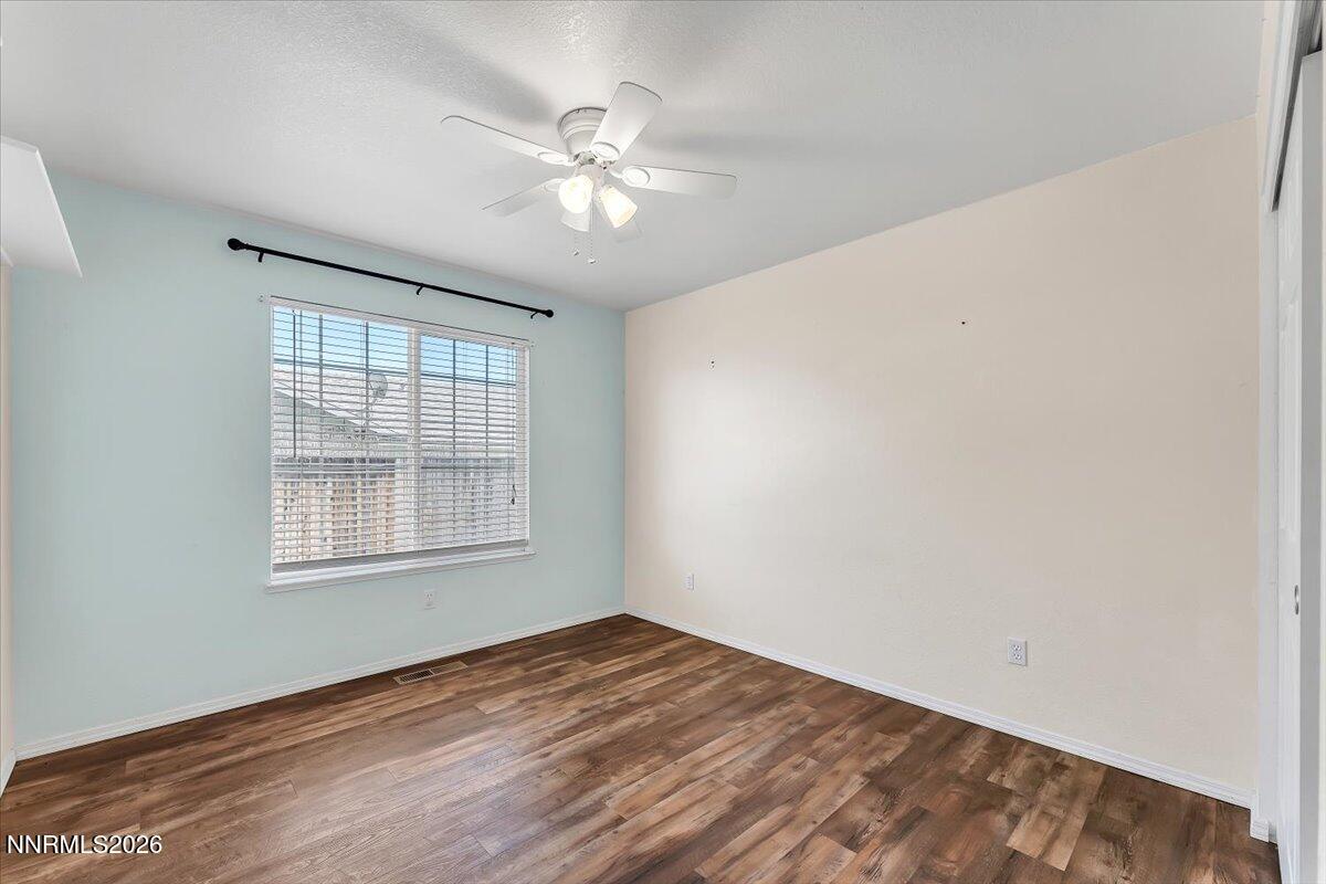 65 Rook Court Sparks, NV 89441 - Photo 25 of 41 a view of an empty room with wooden floor and a window