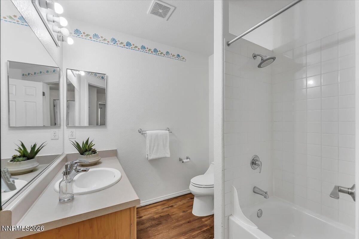 65 Rook Court Sparks, NV 89441 - Photo 26 of 41 a bathroom with a sink a toilet and shower