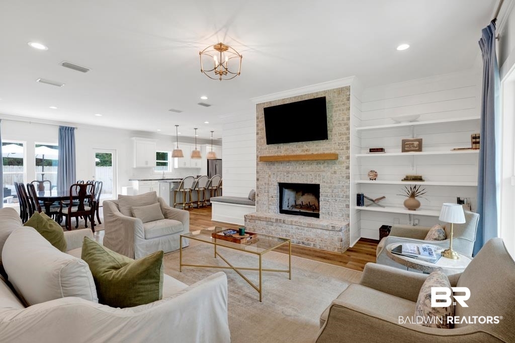 379 Pecan Ridge Boulevard Fairhope, AL 36532 - Photo 3 of 21 Bright living area with wood-finish flooring