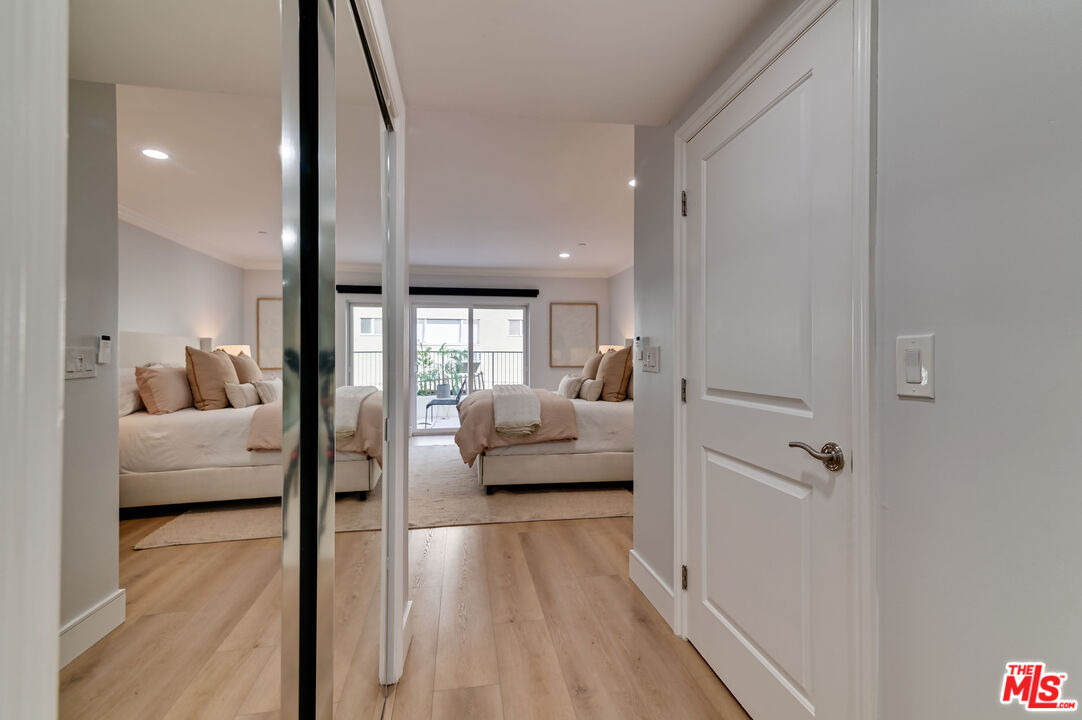 1878 Greenfield Avenue, Unit 104 Los Angeles, CA 90025 - Photo 19 of 35 a living room with furniture and a large window