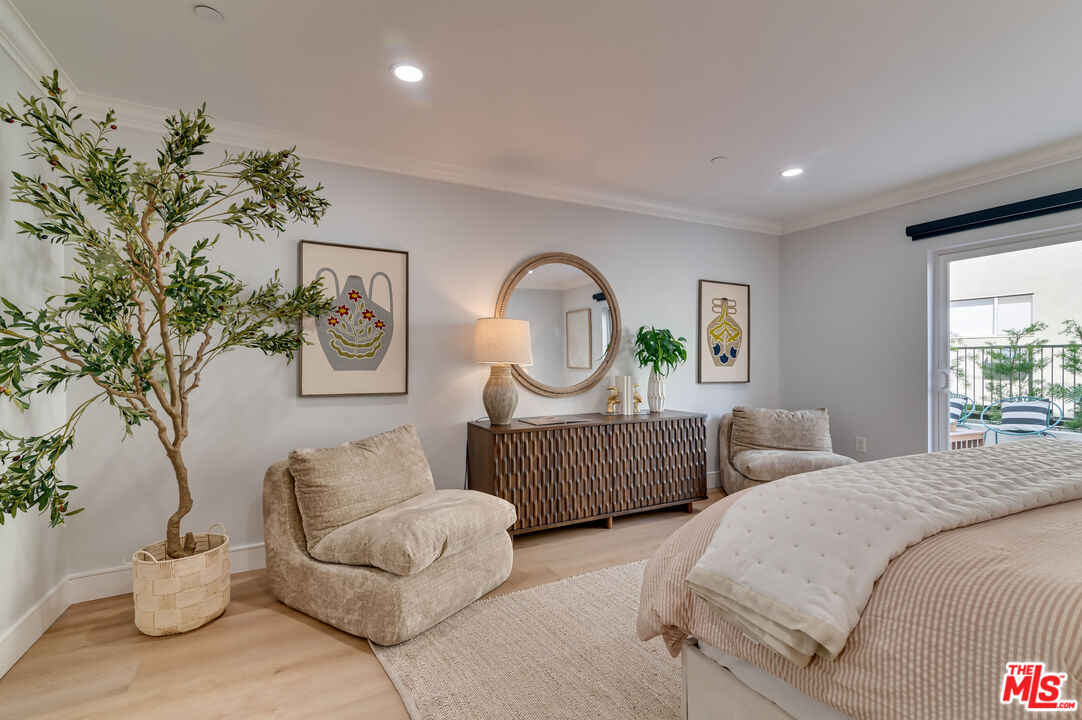 1878 Greenfield Avenue, Unit 104 Los Angeles, CA 90025 - Photo 28 of 35 a bedroom with bed and a couch