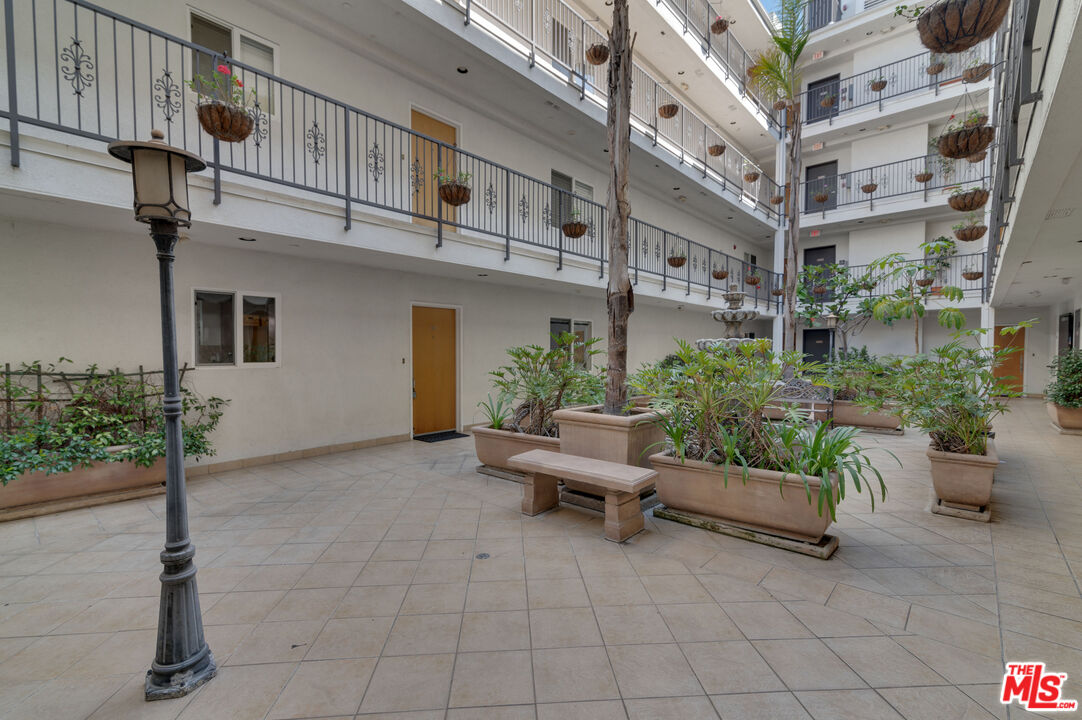 1878 Greenfield Avenue, Unit 104 Los Angeles, CA 90025 - Photo 33 of 35 a view of a building with sitting area